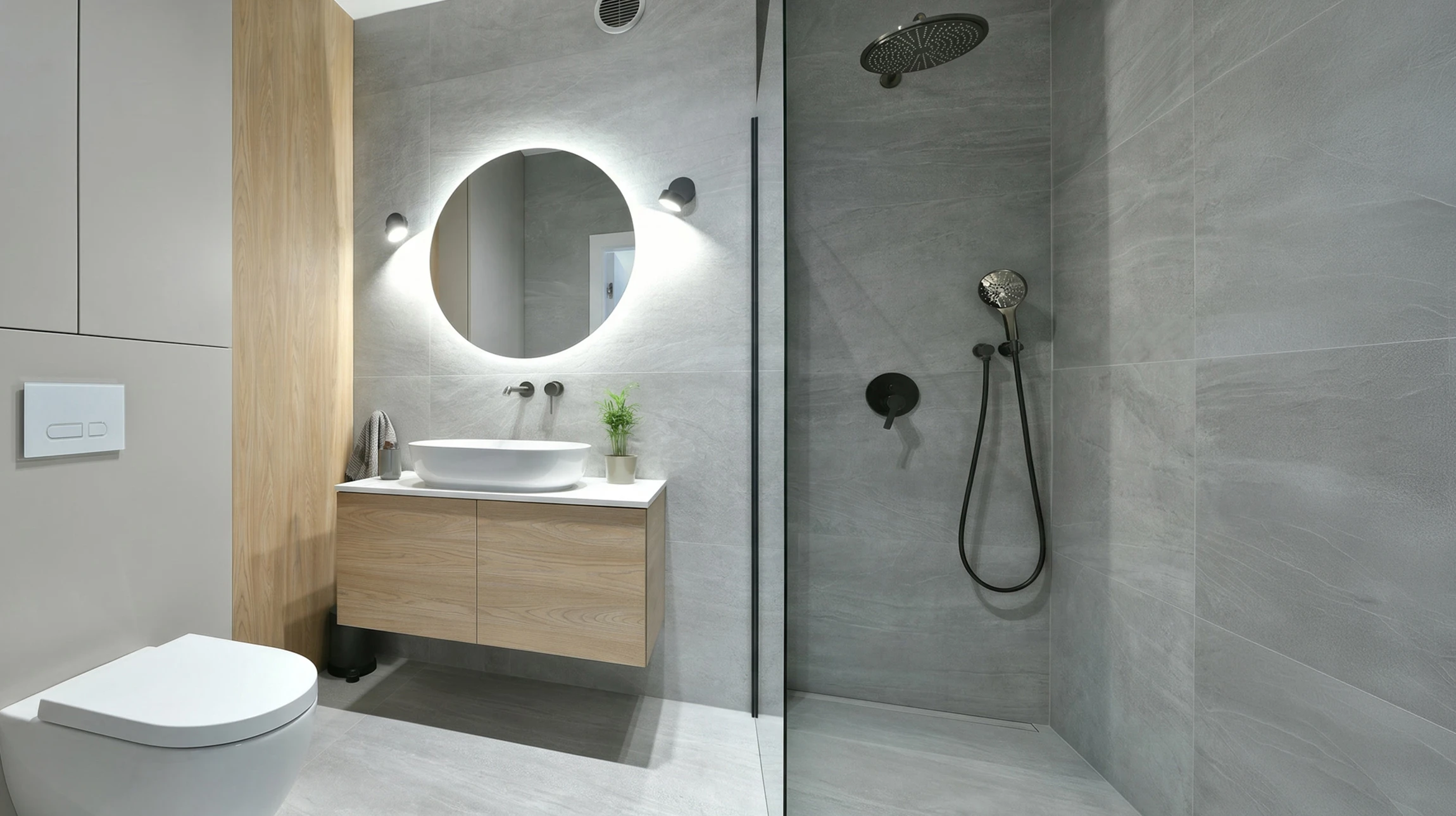 Salle de bain moderne avec baignoire îlot blanche aux pieds chromés, vasque suspendue rectangulaire, robinetterie noire mate